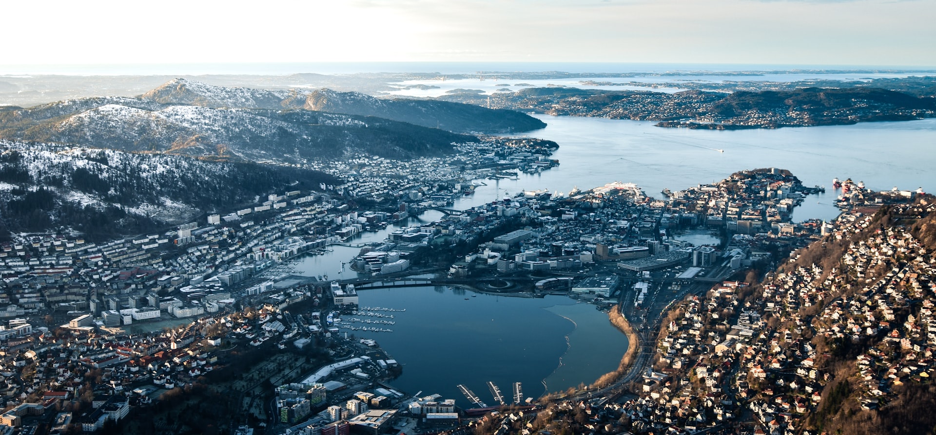 aerial photography of city and mountain