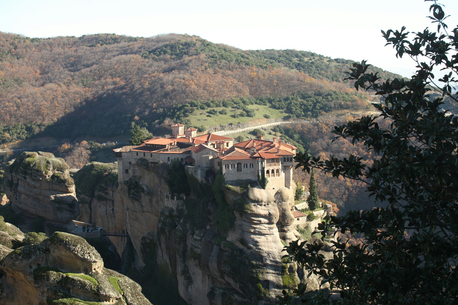 a cliff with a house on top of it